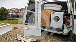 Packing household furniture into a van for a house move