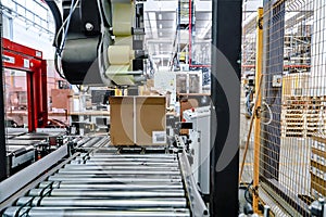packing line - conveyor belts inside a logistics warehouse