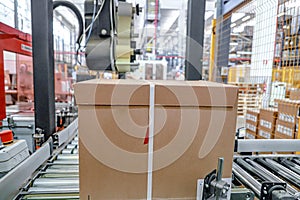 packing line - conveyor belts inside a logistics warehouse