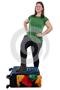 Packing suitcase luggage bag young woman travel traveling vacation holidays isolated