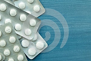 Packings of white pills of medicines