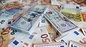 Packs of dollars end euro on the table