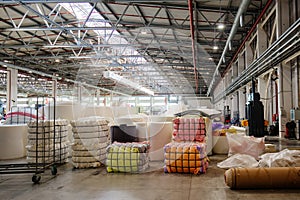 Packs of foam rubber in warehouse