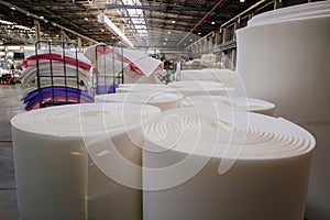 Packs of rolled foam rubber in warehouse