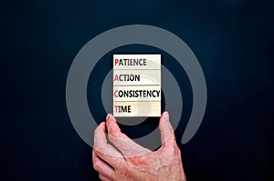 PACT patience action consistency time symbol. Concept words PACT patience action consistency time on blocks on black background.