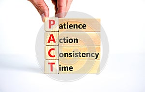 PACT patience action consistency time symbol. Concept words PACT patience action consistency time on blocks on white background.
