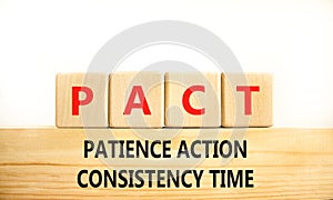 PACT patience action consistency time symbol. Concept words PACT patience action consistency time on blocks on white background.