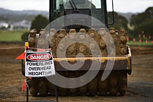 A pad-foot roller on site danger sign