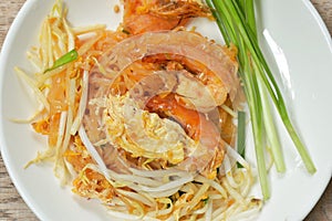 Pad Thai stir fried rice noodles with shrimp and egg on plate