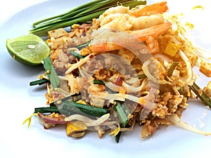 Pad Thai, stir-fried rice noodles with shrimp in white dish on white background. The one of Thailand's national main dish. th