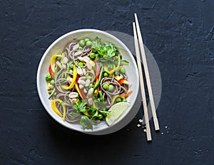Pad Thai vegetables soba noodles on dark background, top view. Healthy vegetarian food
