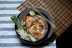 Pad Thai with wooden texture on background