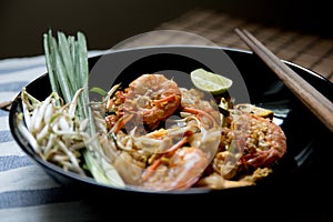 Pad Thai with wooden texture on background