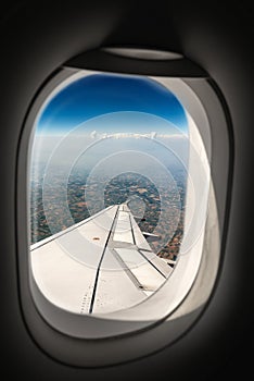 Padan Plain seen Through the Porthole Window with Airplane Wing