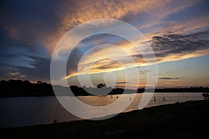 Paddle boarders on lake at sunset in West Texas photo