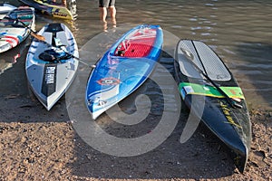 Paddle boards with very different paint jobs