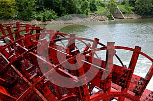 Paddle boat wheel spinning in the water