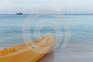 Paddle boats on white sandy beach