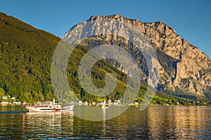 Paddle steamer on Lake Traunsee with Traunstein mountain at sunset, Gmunden, Austria