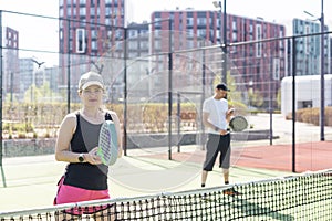 paddle tennis couple players ready for class