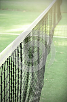 Paddle or tennis net in the tennis court.