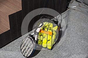 paddle tennis objects in court, racket and balls photo