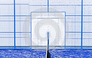 Paddle tennis and tennis net on blue court. Tennis competion concept. Horizontal sport poster, greeting cards, headers, website