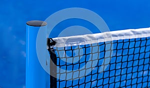 Paddle tennis and tennis net on blue court. Tennis competion concept. Horizontal sport poster, greeting cards, headers, website