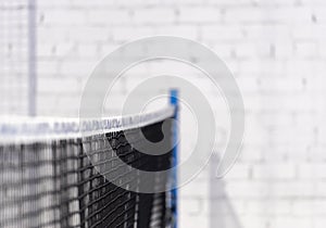 Paddle tennis and tennis net on blue court. Tennis competion concept. Horizontal sport poster, greeting cards, headers, website