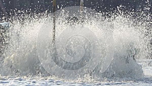 Paddle wheels aerators in black water on canal.