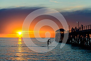 Paddleboard surfing man