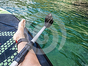 Paddleboarding near the shore. Have a rest time.