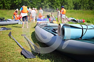 Paddles, inflatable boat and people out of focus photo