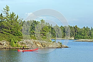 Paddling a Canoe on a Lake in Canada