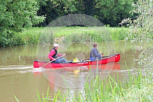 Paddling a canoe.