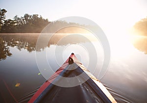 Paddling kayak sunrise light