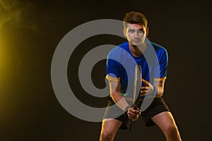 Padel Tennis Player with Racket in Hand. Paddle tenis, on a black background. Download in high resolution.