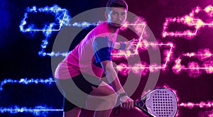 Padel Tennis Player with Racket in Hand. Paddle tenis, on a blue background. Download in high resolution.