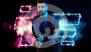 Padel tennis player with racket. Man athlete with racket on court with neon colors. Sport concept. Download a high