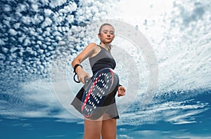 Padel tennis player with racket. Woman athlete with paddle racket on court outdoors. Sport concept. Download a high