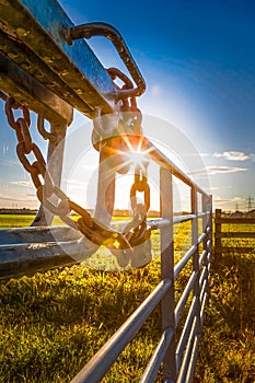 Padlock and chain on a farm gate