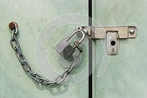 Padlock chained and locked on door