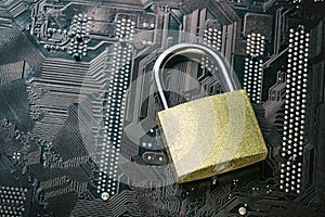 Padlock on computer motherboard. Internet data privacy information security concept