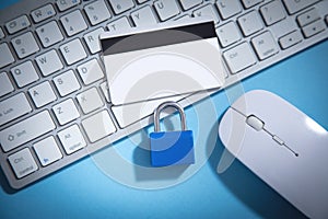 Padlock, credit card on the computer keyboard. Credit card security