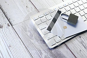 Padlock and credit card on keyboard. Internet data security concept