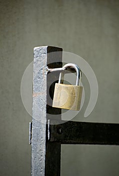 Padlock on gate at construction site - lock on closed fence.