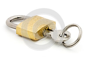 Padlock and key over white