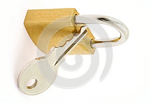 Padlock and key on white