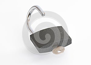 Padlock and key on white background .