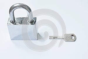 Padlock and key on white background